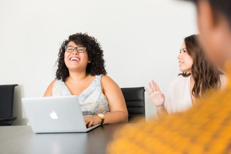 women at work in a meeting with laptop
