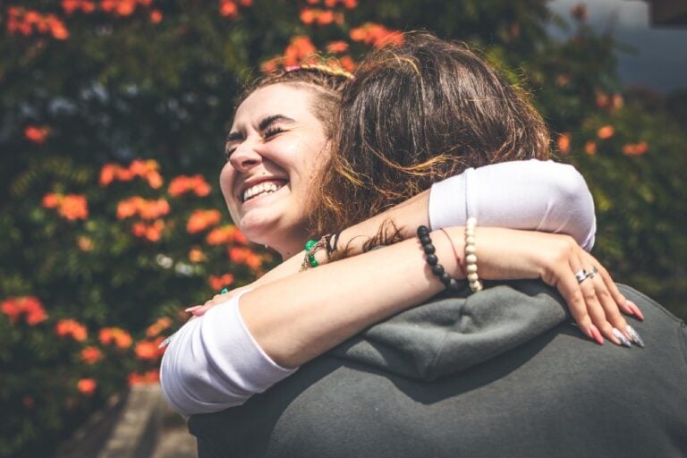 girl hugging a man who likes her