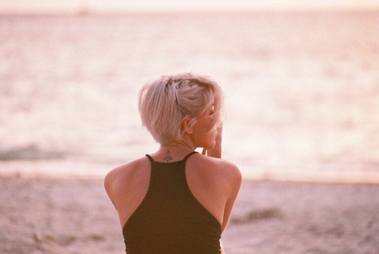blonde woman meditating after a breakup