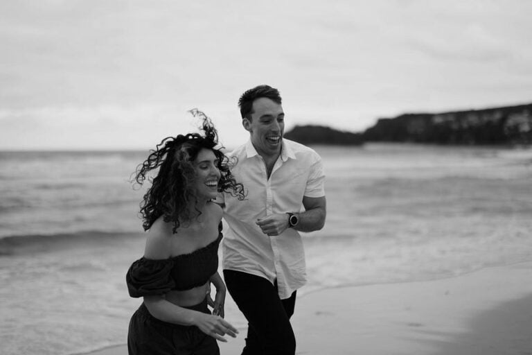 aries and aquarius couple walking on the beach