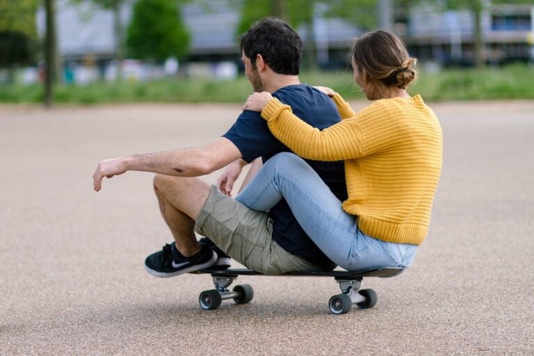 aries and taurus couple having fun on a skate