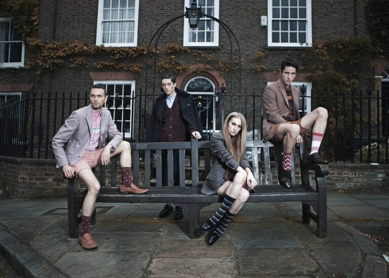 group of young people on a bench