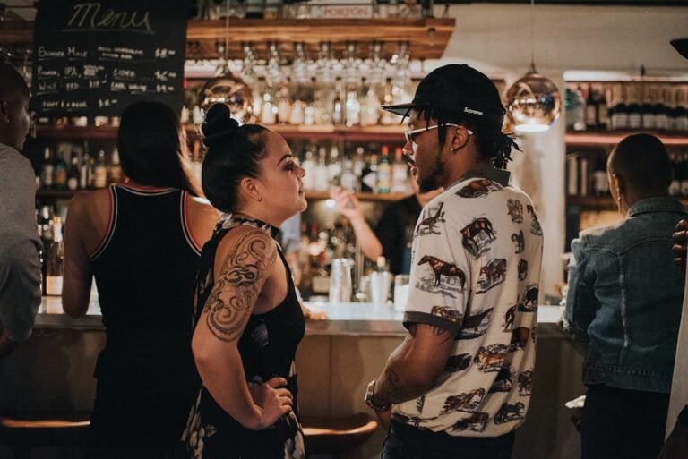 beautiful couple on a date talking in a bar