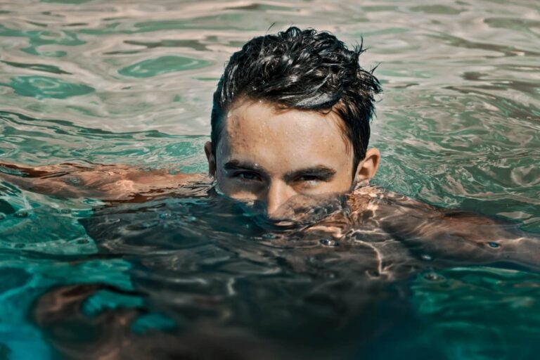 guy with blue eyes in the water staring