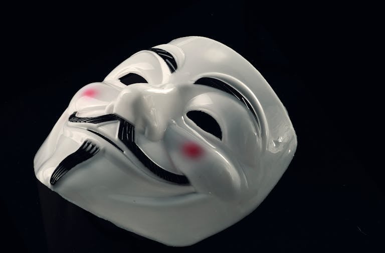 A mysterious Guy Fawkes mask symbolizing anonymity and incognito presence.