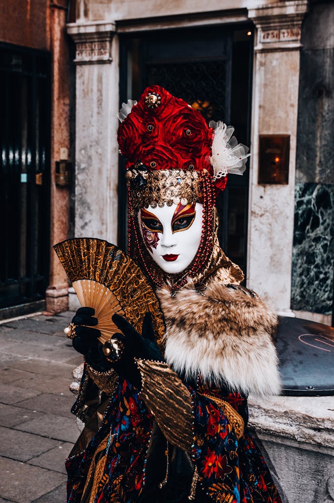 Elegant masquerade costume with ornate mask in Venice's streets, showcasing rich colors and textures.