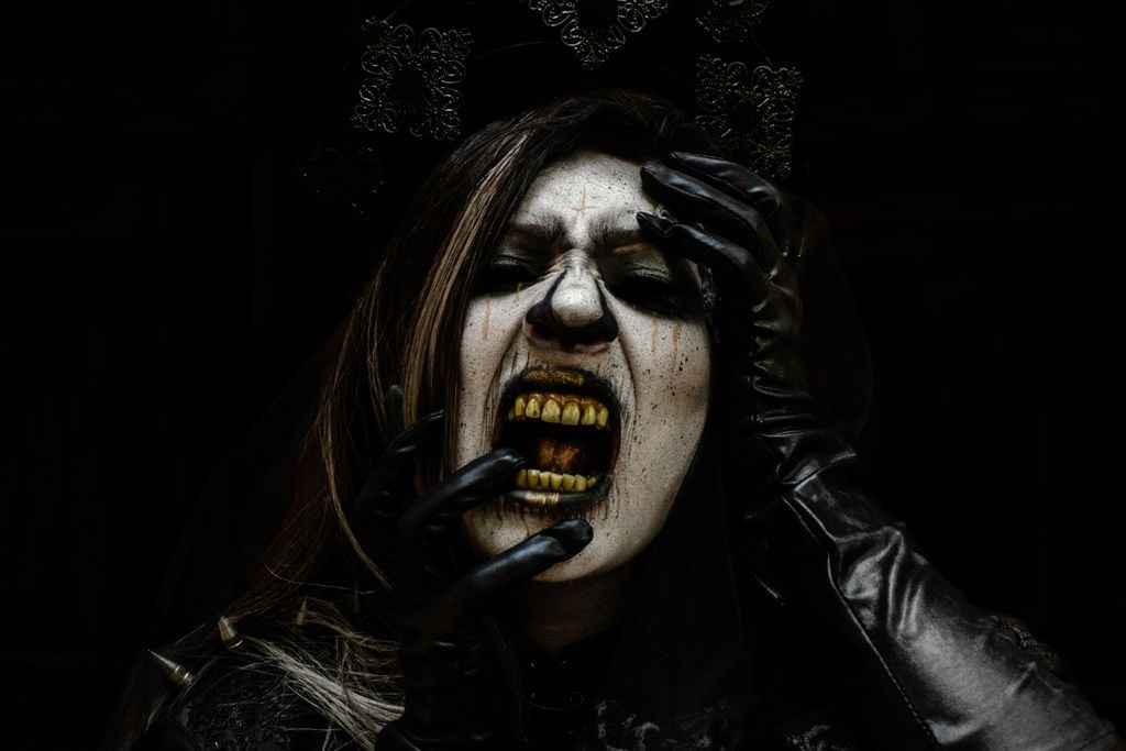 Close-up of a woman in horror makeup with a gothic style, perfect for Halloween themes.