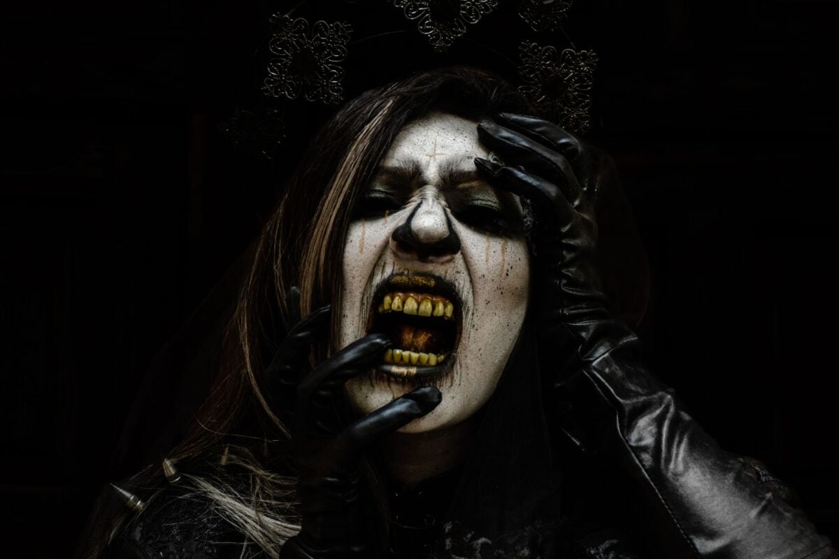 Close-up of a woman in horror makeup with a gothic style, perfect for Halloween themes.